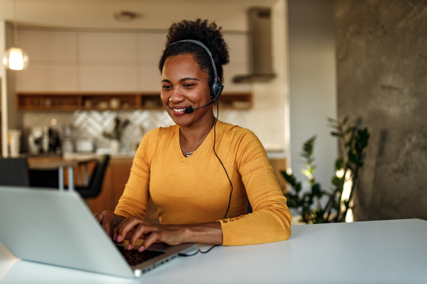 IT support agent onboarding onto support tools at her remote workstation with ease and efficiency