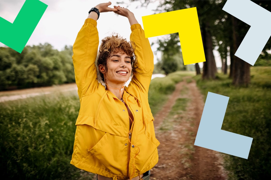 : A woman enjoying herself outdoors while attending a call remotely.